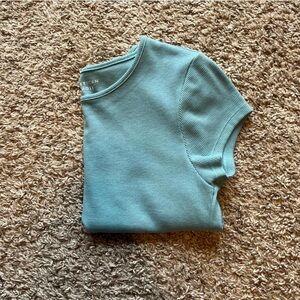 Small blue american eagle shirt.
